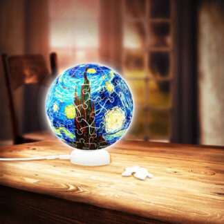 A Starry Night Sphere Light sitting on a wooden table.