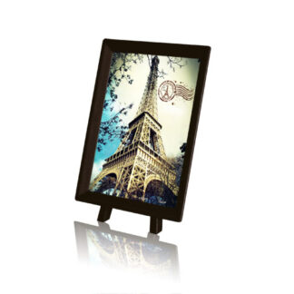 A Seashell on the Beach featuring a picture frame with a picture of the eiffel tower.