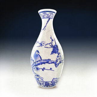 A blue and white Japanese Doll Puzzle Vase.