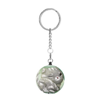 A Cantaloupe Puzzle Keychain with a gray cat on it.