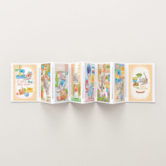 A folded card of Cat's Play Time 8-in-1 with a picture of a cat and a dog, forming a puzzle.