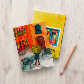 A watercolor painting of a woman holding an umbrella next to the Love Corner Puzzle Cover, creating a visual puzzle.